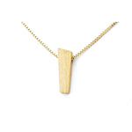 Brushed pendant in gold